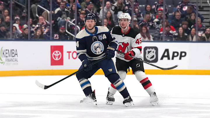 Blue Jackets forward Mathieu Olivier jockeys for position against New Jersey's Colton White. Blue Jackets forward Mathieu Olivier jockeys for position against New Jersey's Colton White.