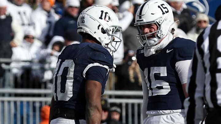 Penn State Nittany Lions running back Nicholas Singleton (10) celebrates with quarterback Drew Allar (15) after scoring a touchdown vs. SMU in the College Football Playoff. Penn State Nittany Lions running back Nicholas Singleton (10) celebrates with quarterback Drew Allar (15) after scoring a touchdown vs. SMU in the College Football Playoff.