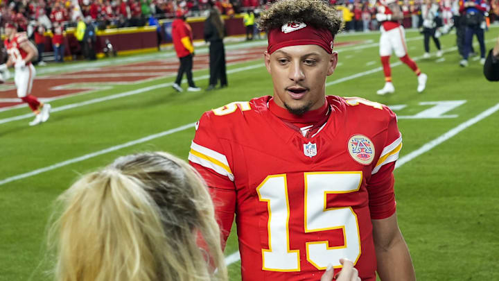 Kansas City Chiefs quarterback Patrick Mahomes (15) greets wife Brittany Mahomes prior to a game against the Los Angeles Chargers at GEHA Field at Arrowhead Stadium.