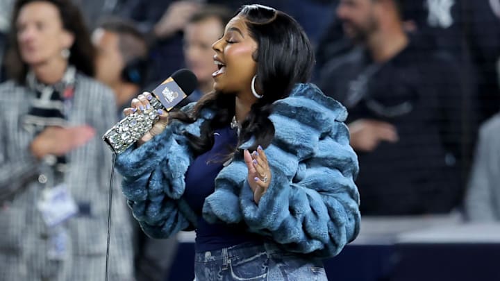 Ashanti  performs the national anthem before Game 4 of the 2024 MLB World Series between the Los Angeles Dodgers and New York Yankees at Yankee Stadium.