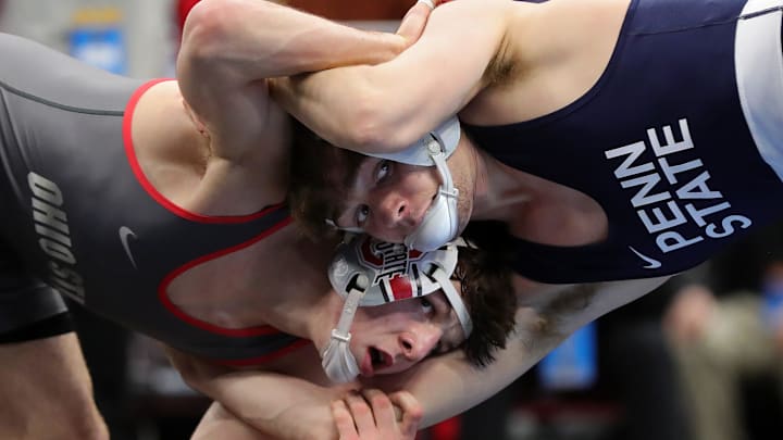 Ohio State’s Ben Davino, bottom, and Penn State’s Marcus Blaze lock up during their 133 pound semifinal match in the NCAA Division I wrestling championships at Rocket Arena, March 20, 2026, in Cleveland, Ohio. Ohio State’s Ben Davino, bottom, and Penn State’s Marcus Blaze lock up during their 133 pound semifinal match in the NCAA Division I wrestling championships at Rocket Arena, March 20, 2026, in Cleveland, Ohio.