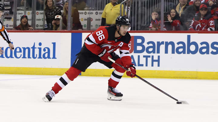 Dec 6, 2024; Newark, New Jersey, USA; New Jersey Devils center Jack Hughes (86) skates with the puck against the Seattle Kraken during the second period at Prudential Center. Mandatory Credit: Ed Mulholland-Imagn Images