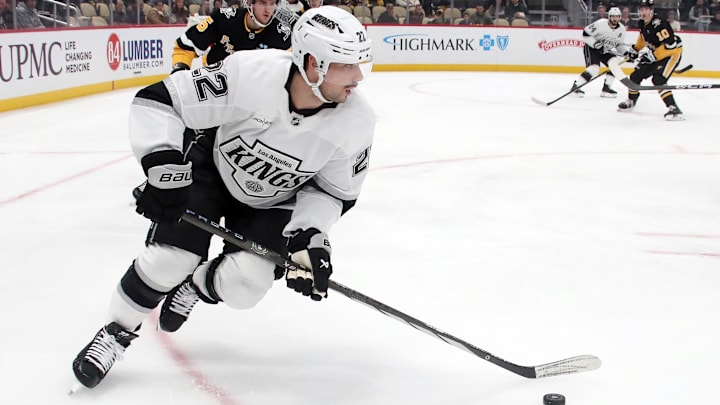 Dec 17, 2024; Pittsburgh, Pennsylvania, USA;  Los Angeles Kings left wing Kevin Fiala (22) skates with the puck against the Pittsburgh Penguins during the first period at PPG Paints Arena. Mandatory Credit: Charles LeClaire-Imagn Images