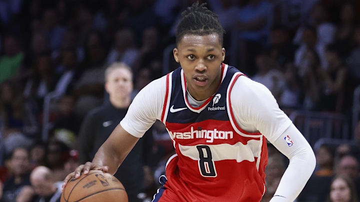Apr 13, 2025; Miami, Florida, USA;  Washington Wizards guard Bub Carrington (8) drives the ball against the Miami Heat during the second half at Kaseya Center. Mandatory Credit: Rhona Wise-Imagn Images