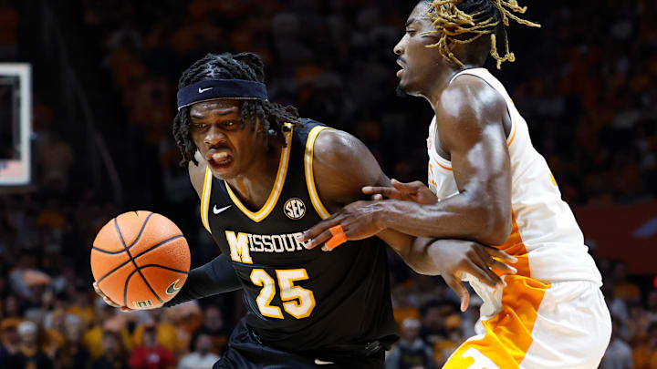 Missouri Tigers forward Mark Mitchell (25) drives on a defender, in a game versus the Tennessee Volunteers this season.