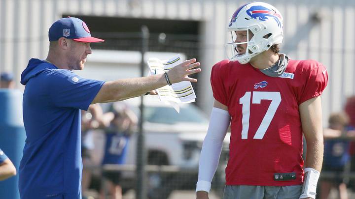 Bills quarterback Josh Allen talks with offensive coordinator Joe Brady between drills. Bills quarterback Josh Allen talks with offensive coordinator Joe Brady between drills.