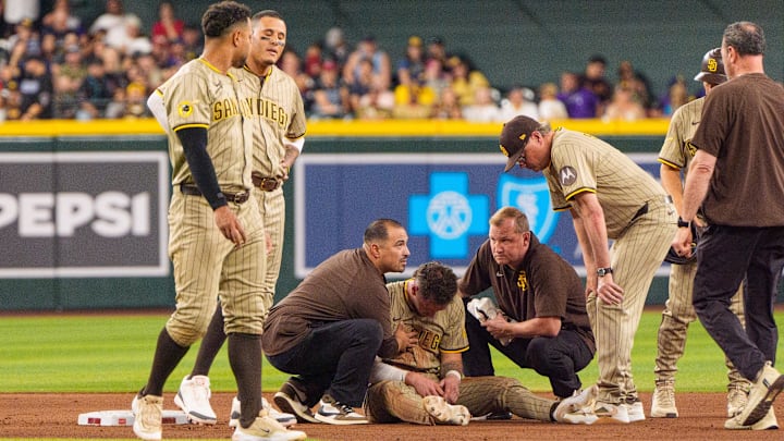 Jun 14, 2025; Phoenix, Arizona, USA; A general view as members of the San Diego Padres react after outfielder Jackson Merrill (3) is injured sliding into second base in the seventh inning against the Arizona Diamondbacks at Chase Field. Mandatory Credit: Allan Henry-Imagn Images Jun 14, 2025; Phoenix, Arizona, USA; A general view as members of the San Diego Padres react after outfielder Jackson Merrill (3) is injured sliding into second base in the seventh inning against the Arizona Diamondbacks at Chase Field. Mandatory Credit: Allan Henry-Imagn Images