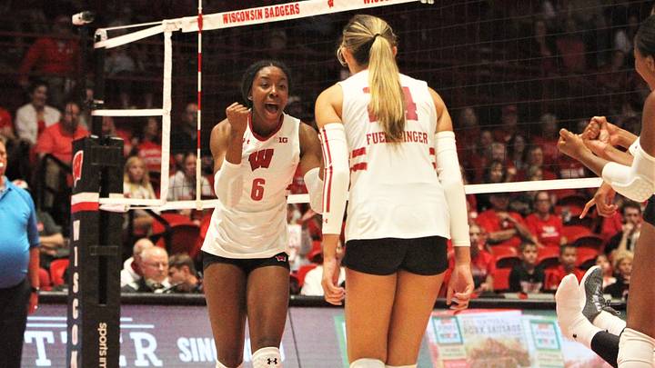 Wisconsin's Trinity Shadd-Ceres (6) celebrates a point with setter Charlie Fuerbringer during the Badgers sweep of Bradley in an exhibition match Tuesday August 20, 2024 at the Kohl Center in Madison, Wisconsin.
