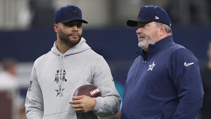 Jan 5, 2025; Arlington, Texas, USA; Dallas Cowboys quarterback Dak Prescott (4) talks to head coach Mike McCarthy before the game against the Washington Commanders at AT&T Stadium. Mandatory Credit: Tim Heitman-Imagn Images