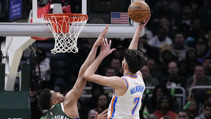 Jan 21, 2026; Milwaukee, Wisconsin, USA; Oklahoma City Thunder center/forward Chet Holmgren (7) puts up a shot against  Milwaukee Bucks forward Giannis Antetokounmpo (34) in the first half at Fiserv Forum. Mandatory Credit: Michael McLoone-Imagn Images