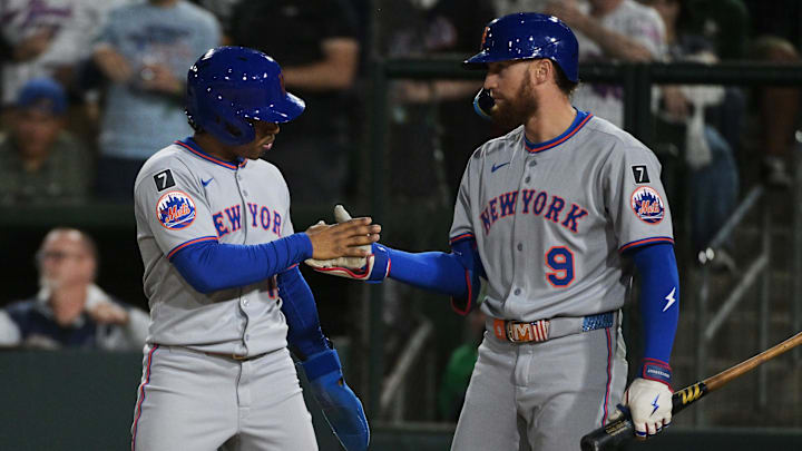 Apr 11, 2025; West Sacramento, California, USA; New York Mets shortstop Francisco Lindor (12) celebrates with outfielder Brandon Nimmo (9) after the Mets scored against the Oakland Athletics during the sixth inning at Sutter Health Park. Mandatory Credit: Ed Szczepanski-Imagn Images