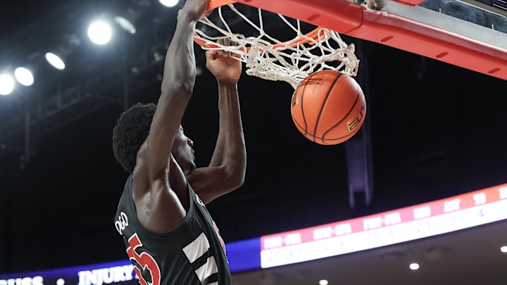 Mar 1, 2025; Houston, Texas, USA;Cincinnati Bearcats forward Aziz Bandaogo (55) dunks against the Houston Cougars in the second half at Fertitta Center. Mandatory Credit: Thomas Shea-Imagn Images