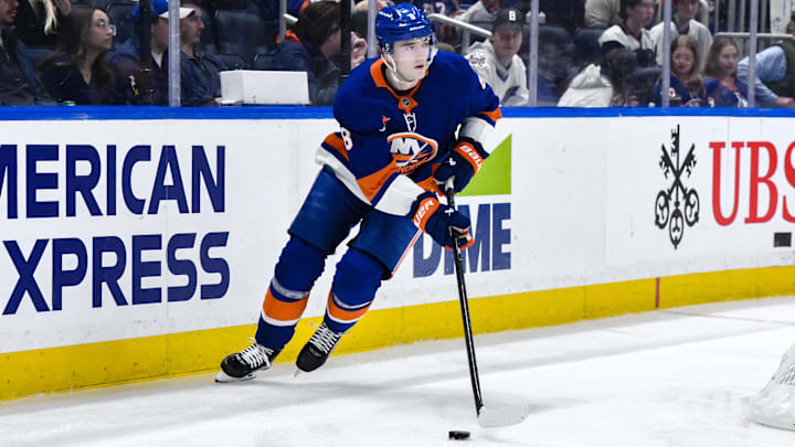 Apr 15, 2025; Elmont, New York, USA; New York Islanders defenseman Noah Dobson (8) skates with the puck during the third period against the Washington Capitals at UBS Arena. Mandatory Credit: John Jones-Imagn Images