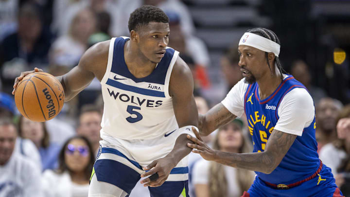 May 10, 2024; Minneapolis, Minnesota, USA; Minnesota Timberwolves guard Anthony Edwards (5) backs towards the basket as Denver Nuggets guard Kentavious Caldwell-Pope (5) plays defense in the first half during game three of the second round for the 2024 NBA playoffs at Target Center. Mandatory Credit: Jesse Johnson-USA TODAY Sports