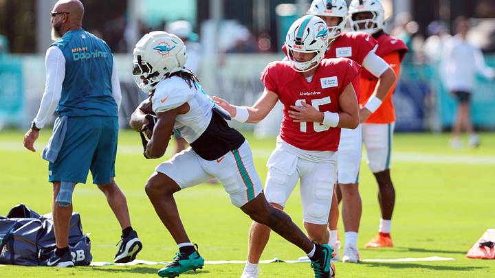 Miami Dolphins quarterback Cam Miller (15) works with running back Jaylen Wright (5) during a joint practice with the New York Giants at the Baptist Health Training Complex. Mandatory Credit: Sam Navarro-Imagn Images