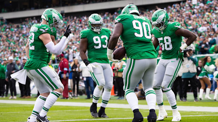 Dec 29, 2024; Philadelphia, Pennsylvania, USA; Philadelphia Eagles Jordan Davis (90) and  Milton Williams (93) and Jalyx Hunt (58) and Reed Blankenship (32) celebrate during the second quarter against the Dallas Cowboys at Lincoln Financial Field. Mandatory Credit: Bill Streicher-Imagn Images