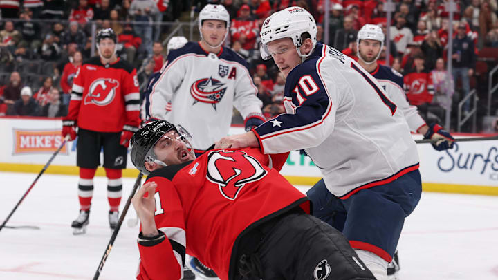 Blue Jackets forward Dmitri Voronkov fights Devils forward Stefan Noesen. 