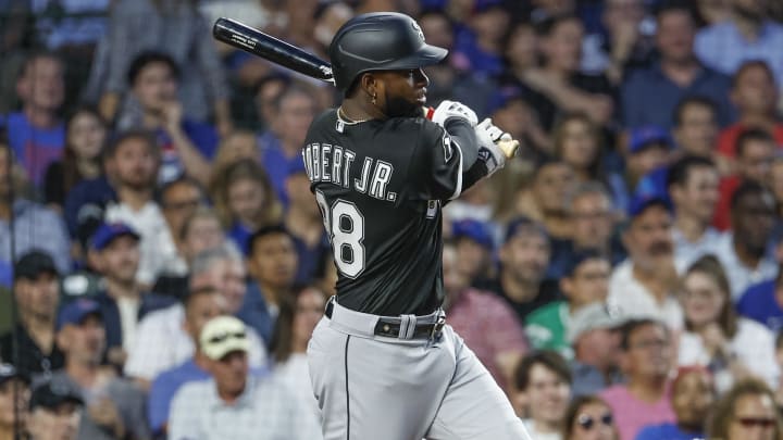 Aug 16, 2023; Chicago, Illinois, USA; Chicago White Sox center fielder Luis Robert Jr. (88) singles against the Chicago Cubs during the fourth inning at Wrigley Field