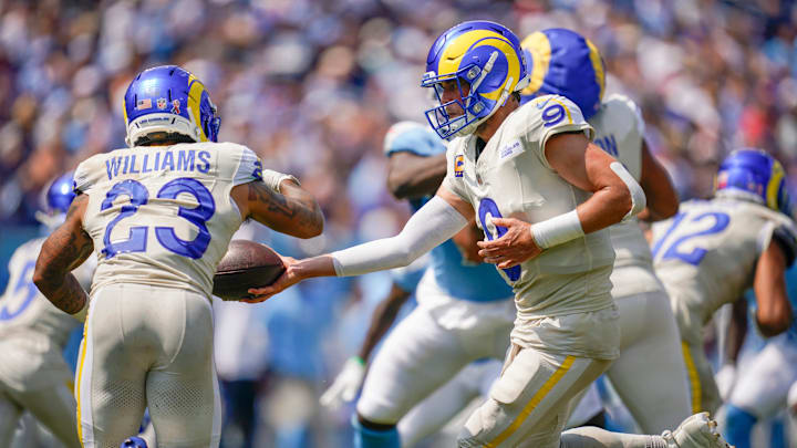 Los Angeles Rams quarterback Matthew Stafford (9) hands off to running back Kyren Williams (23) during the second quarter at Nissan Stadium in Nashville, Tenn., Sunday, Sept. 14, 2025.