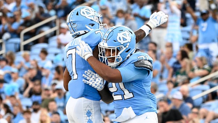 Sep 7, 2024; Chapel Hill, North Carolina, USA; North Carolina Tar Heels running back Davion Gause (21) celebrates with wide receiver Christian Hamilton (7) after scoring a touchdown in the fourth quarter at Kenan Memorial Stadium.