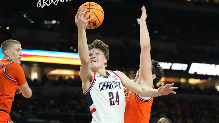 Apr 4, 2026; Indianapolis, IN, USA; Connecticut Huskies guard Braylon Mullins (24) shoot against the Illinois Fighting Illini in the first half during a semifinal of the Final Four of the men's 2026 NCAA Tournament at Lucas Oil Stadium. Mandatory Credit: Robert Deutsch-Imagn Images Apr 4, 2026; Indianapolis, IN, USA; Connecticut Huskies guard Braylon Mullins (24) shoot against the Illinois Fighting Illini in the first half during a semifinal of the Final Four of the men's 2026 NCAA Tournament at Lucas Oil Stadium. Mandatory Credit: Robert Deutsch-Imagn Images