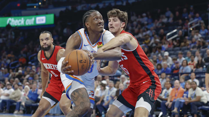 Oct 9, 2024; Oklahoma City, Oklahoma, USA; Oklahoma City Thunder forward Jalen Williams (8) is defended by Houston Rockets guard Reed Sheppard (15) on a drive to the basket during the second quarter at Paycom Center. Mandatory Credit: Alonzo Adams-Imagn Images