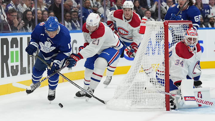 Oct 11, 2023; Toronto, Ontario, CAN; Toronto Maple Leafs center Max Domi (11) battles for  the puck