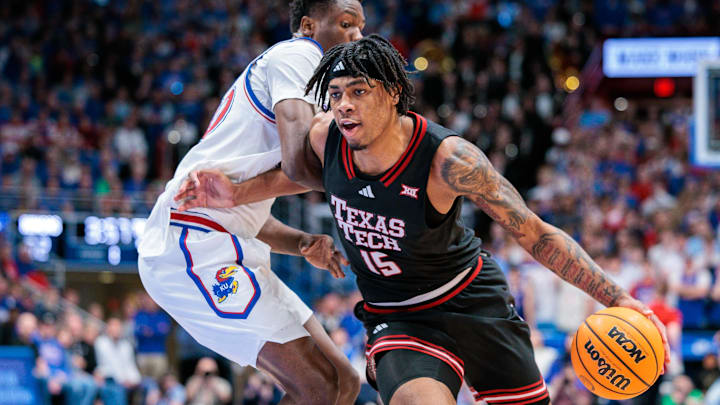 Mar 1, 2025; Lawrence, Kansas, USA; Texas Tech Red Raiders forward JT Toppin (15) drives to the basket during the first half against the Kansas Jayhawks at Allen Fieldhouse. Mandatory Credit: William Purnell-Imagn Images
