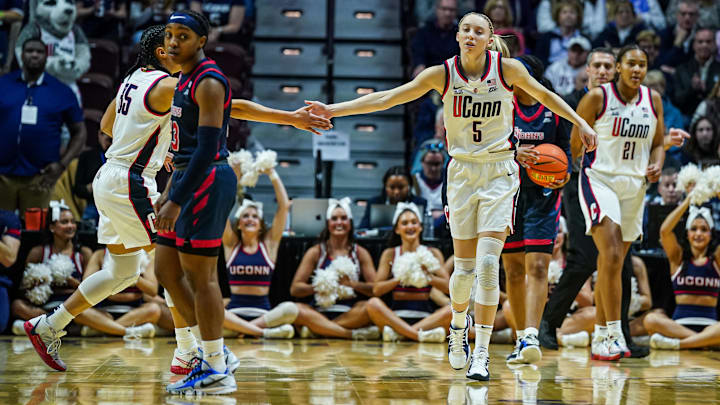 Mar 8, 2025; Uncasville, CT, USA; UConn Huskies guard Paige Bueckers (5) reacts after a play against the St. John's Red Storm in the first half at Mohegan Sun Arena. Mandatory Credit: David Butler II-Imagn Images