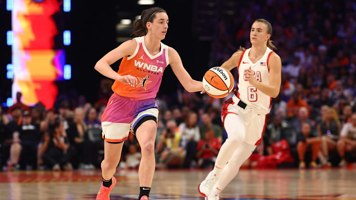 Jul 20, 2024; Phoenix, AZ, USA; Team WNBA guard Caitlin Clark (left) against USA Women's National Team guard Sabrina Ionescu (6) during the 2024 WNBA All Star Game at Footprint Center. Mandatory Credit: Mark J. Rebilas-Imagn Images