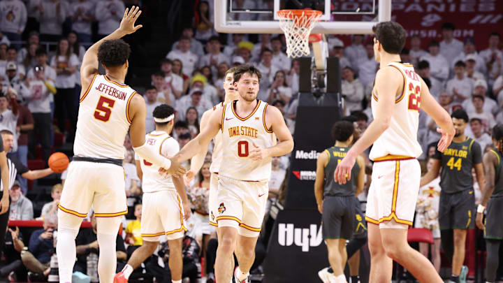 Feb 7, 2026; Ames, Iowa, USA; Iowa State Cyclones forward Joshua Jefferson (5) and Iowa State Cyclones forward Milan Momcilovic (22) wait to celebrate with Iowa State Cyclones guard Nate Heise (0) after the basket in their game with the Baylor Bears during the second half at James H. Hilton Coliseum. 