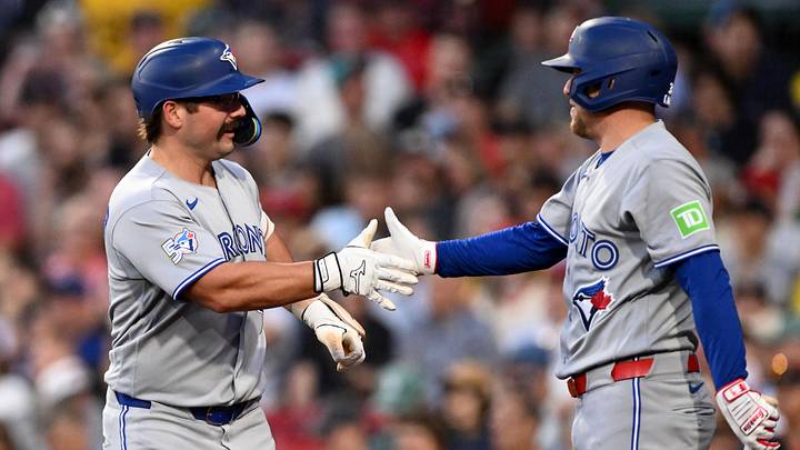 Davis Schneider and Myles Straw high five in grey Toronto jeresey