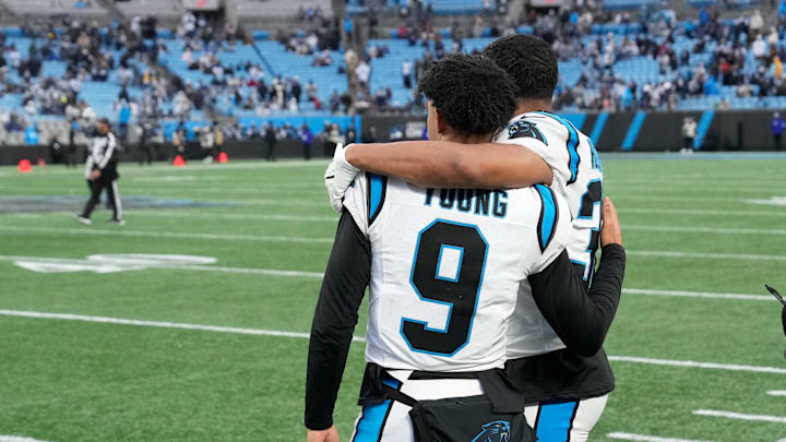 Dec 15, 2024; Charlotte, North Carolina, USA; Carolina Panthers quarterback Bryce Young (9) and running back Chuba Hubbard (30) at the end of the game at Bank of America Stadium. Mandatory Credit: Bob Donnan-Imagn Images