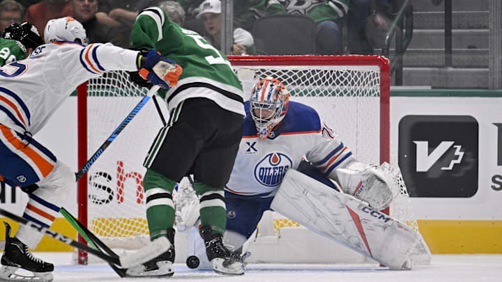 Nov 4, 2025; Dallas, Texas, USA; Edmonton Oilers goaltender Stuart Skinner (74) stops a shot by Dallas Stars center Wyatt Johnston (53) during the first period at the American Airlines Center. Mandatory Credit: Jerome Miron-Imagn Images