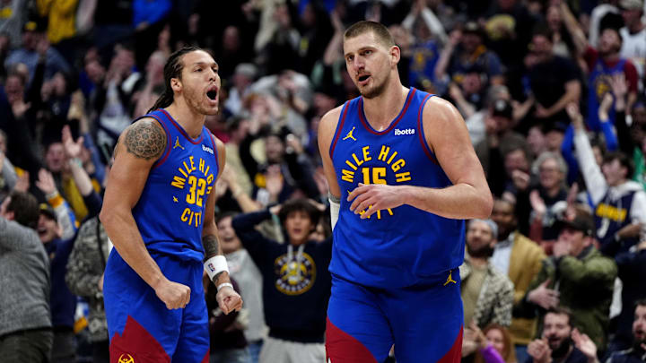 Jan 23, 2025; Denver, Colorado, USA; Denver Nuggets center Nikola Jokic (15) reacts along side forward Aaron Gordon (32)  following a full court basket made in the second half against the Sacramento Kings at Ball Arena. Mandatory Credit: Ron Chenoy-Imagn Images