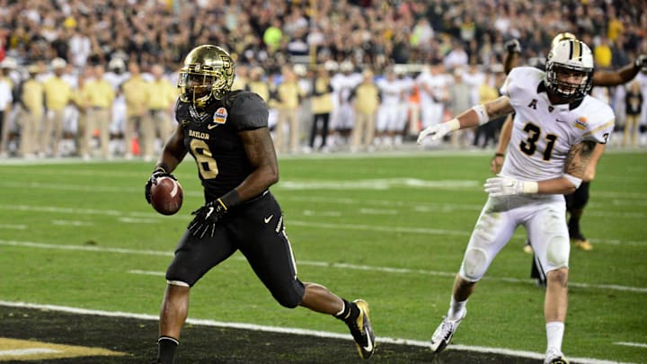 Jan 1, 2014; Glendale, AZ, USA; Baylor Bears running back Glasco Martin (8) scores a 9 yard touchdown during the second half against the UCF Knights in the Fiesta Bowl at University of Phoenix Stadium. Mandatory Credit: Matt Kartozian-Imagn Images