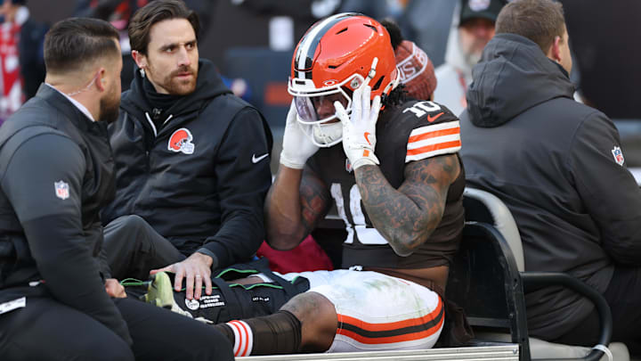 Dec 21, 2025; Cleveland, Ohio, USA;  Cleveland Browns running back Quinshon Judkins (10) is carted off the field after going down with an apparent injury against the Buffalo Bills during the first half at Huntington Bank Field. Mandatory Credit: Scott Galvin-Imagn Images