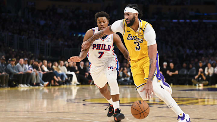 Nov 8, 2024; Los Angeles, California, USA; Los Angeles Lakers center Anthony Davis (3) drives against Philadelphia 76ers guard Kyle Lowry (7) during the second half at Crypto.com Arena. Mandatory Credit: Jonathan Hui-Imagn Images