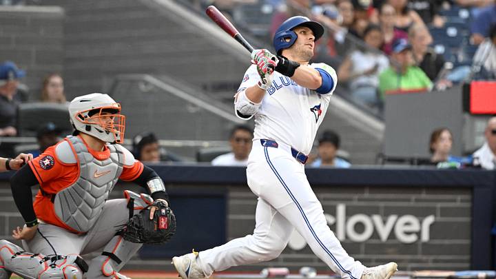 Jun 23, 2026; Toronto, Ontario, CAN;  Toronto Blue Jays center fielder Daulton Varsho (5) hits a two run home run against the Houston Astros in the seventh inning at Rogers Centre. Mandatory Credit: Dan Hamilton-Imagn Images