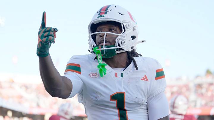 Sep 4, 2026; Stanford, California, USA;  Miami Hurricanes wide receiver Malachi Toney (1) reacts towards the stands after scoring a touchdown against the Stanford Cardinal during the first quarter at Stanford Stadium.  Mandatory Credit: Stan Szeto-Imagn Images
