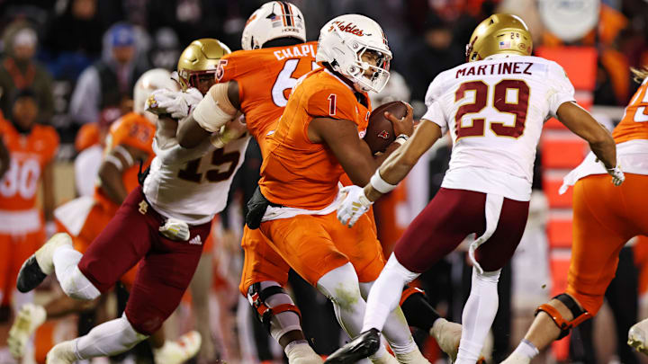 Oct 17, 2024; Blacksburg, Virginia, USA; Virginia Tech Hokies quarterback Kyron Drones (1) is sacked by Boston College Eagles defensive back Cameron Martinez (29) during the third quarter at Lane Stadium. Mandatory Credit: Peter Casey-Imagn Images Oct 17, 2024; Blacksburg, Virginia, USA; Virginia Tech Hokies quarterback Kyron Drones (1) is sacked by Boston College Eagles defensive back Cameron Martinez (29) during the third quarter at Lane Stadium. Mandatory Credit: Peter Casey-Imagn Images