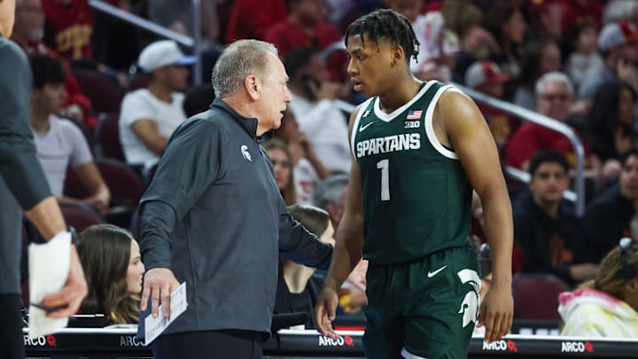 Michigan State Head Coach Tom Izzo talks to  guard Jeremy Fears Jr. (1) on the sideline 