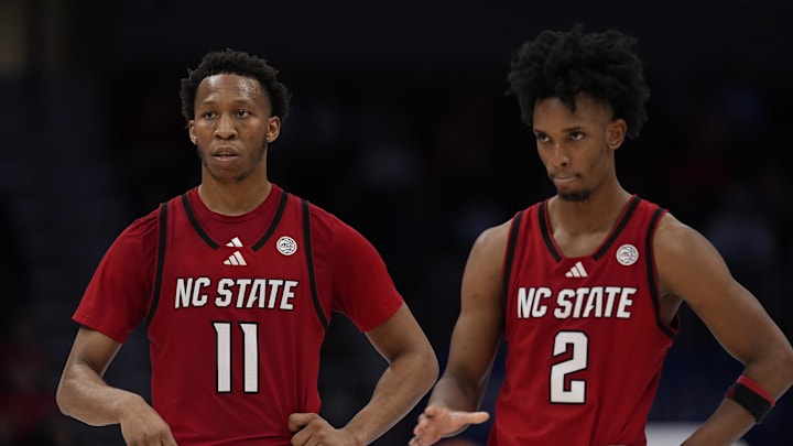 NC State Wolfpack guard Quadir Copeland (11) and guard Jr. Paul McNeil (2) in the final seconds during the second half against the Virginia Cavaliers at Spectrum Center. NC State Wolfpack guard Quadir Copeland (11) and guard Jr. Paul McNeil (2) in the final seconds during the second half against the Virginia Cavaliers at Spectrum Center.