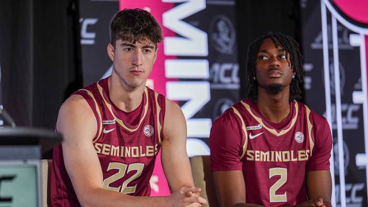 Oct 7, 2026; Charlotte, NC, USA; Florida State Seminoles Sebastian Rancik (22) and Anthony Robinson II (2) listen to their coach answer questions from the media during the ACC Tip-Off in Charlotte, NC. Mandatory Credit: Jim Dedmon-Imagn Images