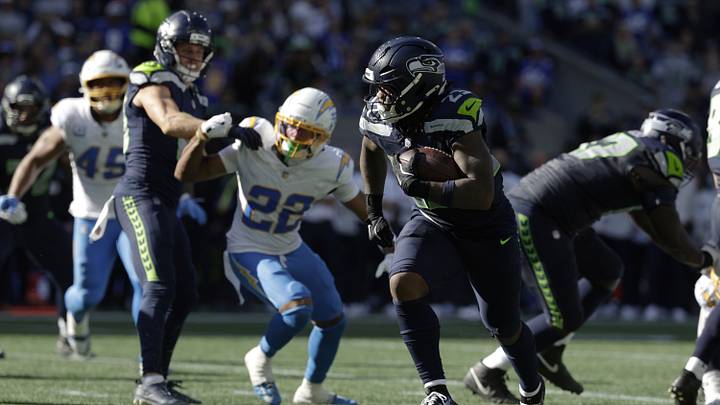 Seattle Seahawks running back Emanuel Wilson (23) runs for a touchdown against the Los Angeles Chargers during the first half at Lumen Field. Seattle Seahawks running back Emanuel Wilson (23) runs for a touchdown against the Los Angeles Chargers during the first half at Lumen Field.