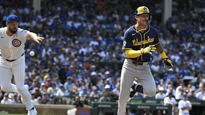 Aug 18, 2025; Chicago, Illinois, USA; Chicago Cubs pitcher Luke Little (43) flips the ball to first base trying to get Milwaukee Brewers shortstop Joey Ortiz (3) out during the sixth inning at Wrigley Field. Mandatory Credit: Matt Marton-Imagn Images Aug 18, 2025; Chicago, Illinois, USA; Chicago Cubs pitcher Luke Little (43) flips the ball to first base trying to get Milwaukee Brewers shortstop Joey Ortiz (3) out during the sixth inning at Wrigley Field. Mandatory Credit: Matt Marton-Imagn Images