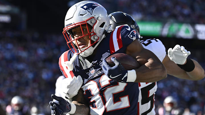 Nov 2, 2025; Foxborough, Massachusetts, USA; New England Patriots running back TreVeyon Henderson (32) runs the ball against the Atlanta Falcons during the first quarter at Gillette Stadium. 