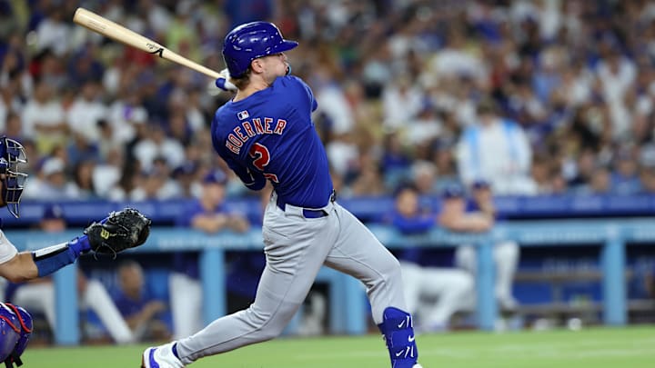 Sep 10, 2024; Los Angeles, California, USA;  Chicago Cubs second baseman Nico Hoerner (2) hits a single during the seventh inning against the Los Angeles Dodgers at Dodger Stadium. Mandatory Credit: Kiyoshi Mio-Imagn Images