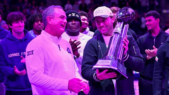 Jan 10, 2026; Fort Worth, Texas, USA; TCU Horned Frogs quarterback Ken Seals (right) and head coach Sonny Dykes (left) celebrate with the Alamo Bowl trophy during the game between the Horned Frogs and the Wildcats at Ed and Rae Schollmaier Arena. Mandatory Credit: Jerome Miron-Imagn Images