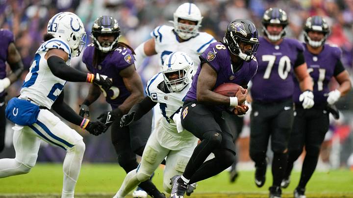 Sep 24, 2023; Baltimore, Maryland, USA; Baltimore Ravens quarterback Lamar Jackson (8) rushes the football while being defended by Indianapolis Colts linebacker Zaire Franklin (44) in the second half at M&T Bank Stadium. Mandatory Credit: Brent Skeen-USA TODAY Sports